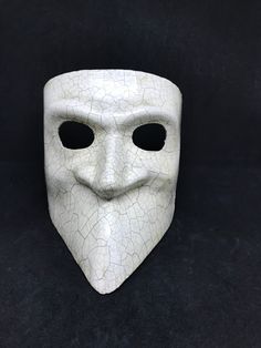 This masquerade mask for men belongs to our collection of historical masks: traditionally they were used in the past centuries in Venice. The name of this mask is Bauta and it was traditionally used by men. It is perfect for any masquerade party, Halloween costume, pro or event in Venice or elsewhere during Carnival. This mask can be gently bent to form to your face and ties in the back with two soft matching ribbons. Since the mask is handmade, your mask could be lightly different from the one Bauta Mask, Mens Masquerade Mask, Mask For Men, Album Art Design, Costume Masks, Venetian Masks, Venetian Mask, Masquerade Party, Costume Mask