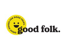 the good folk logo is yellow and black with a smiley face on it's side