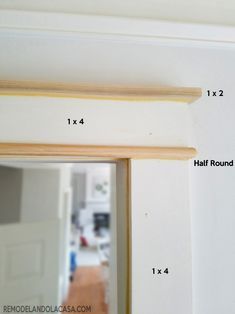 measurements for the top half of a mirror and bottom half of a wall with wood trim