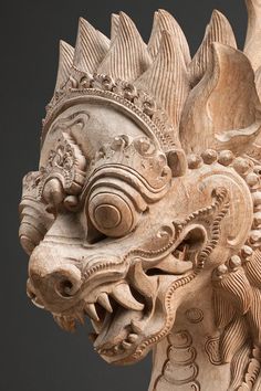 an intricately carved dragon head on display