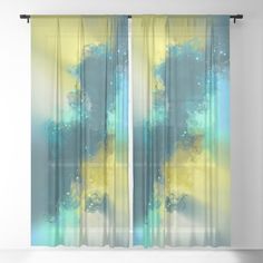 an abstract painting with blue, yellow and green colors on the window curtain paneles