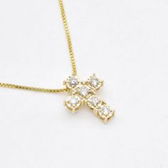 Real Diamond Cross Necklace set with Natural Diamonds, size 2 millimeters each, 0.18 Carats combined.Solid 14k Yellow Gold ☞ made to last.Click here for ☞ Solid Gold Collection**This is a Solid Gold pendant which comes with complimentary '18k Gold Vermeil' chain. For Solid Gold chains, please contact us.Diamond Details:• CERTIFIED Diamond• Weight: 0.18 Carats combined• Dimensions: 2mm each• Cut: RoundSolid Gold Details:• 0.7 grams of 14k Solid Yellow Gold• Dimensions: Length 12.5mm, Width 10mm• Diamond Cross Necklace, Solid Gold Chains, Diamond Cross Pendants, Gold Diamond Necklace, Diamond Cross, Gold Collection, Real Diamonds, Gold Details, Solid Yellow