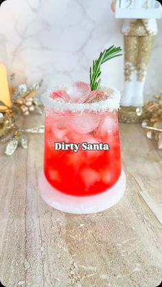 a red drink sitting on top of a wooden table