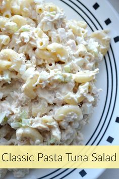 a white plate topped with pasta and chicken salad