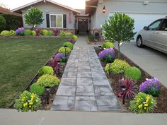 the front yard is clean and ready to be used as a flower bed for landscaping