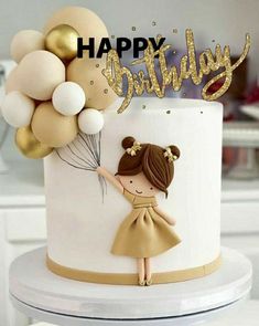 a birthday cake with a girl holding balloons