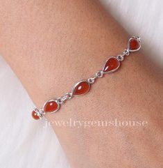 Natural Carnelian Bracelet, 925 Sterling Silver Bracelet, Handmade Bracelet, Women Silver Jewelry, Cabochon Bracelet, Wedding Gift For Women Gemstone - Carnelian  Stone Quality - AAA  Weight - 4.86 gm  Stone Length- 0.8 cm, Stone Width - 0.5 cm Bracelet Length - 6 inch to 9 inch sizes are available, we give 0.5 inch adjustable in the size which you order ( NOTE - 0.5 INCH ADJUSTABLE IS INCLUDED IN YOUR ORDERED SIZE ) Stone Shape - As shown in the picture We serve complete 925 sterling silver Jew Elegant Round Carnelian Bracelets, Silver Carnelian Gemstone Bracelets, Adjustable Silver Carnelian Bracelets, Carnelian Bracelet Jewelry Gift, Silver Carnelian Bracelet With Natural Stones, Silver Carnelian Gemstone Bracelet, Silver Carnelian Bracelets As Gift, Silver Carnelian Bracelet As A Gift, Silver Cabochon Bracelet For Wedding