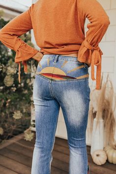 Stay groovy this fall with our 'Amy' pants featuring a medium wash denim material with accent fading and a colorful embroidery design on the back and down the flares! These retro bottoms will take you from season to season, it has a hidden zip fly with a button closure and belt loops, two pockets in the front, none in the back, and a very flattering silhouette that ends in straight floor-length hemlines. Measurements S : Front Rise 10", Hip 30", Inseam 33.5", Length 43", Waist 24". M : Front Ris Stay Groovy, Colorful Embroidery, Denim Material, Model Fits, Hip Length, Embroidery Design, Floor Length, Levi Jeans, Embroidery Designs