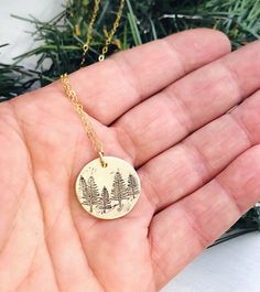 "Tree Necklace - Forest Necklace - Gift for Her - Stocking Stuffer - Winter Birthday Necklace - Pine Tree Necklace - Evergreen Jewelry 5/8\" brass disk is stamped with little pine trees, and given a rustic finish. It hangs from a dainty gold filled cable chain." Nature-inspired Round Necklace For Gift, Nature-inspired Round Necklace For Gifts, Nature-inspired Round Necklaces For Gifts, Green Pendant Jewelry For Birthday, Personalized Nature-inspired Charm Necklace For Gifts, Green Engraved Jewelry As Gift, Handmade Green Necklaces For Birthday Gift, Handmade Green Necklace For Birthday Gift, Green Engraved Necklace For Gift