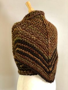 Hand knitted Outlander inspired shawl, scarf in brown blend, shoulder wrap, neck warmer - triangle design, can be worn in many different ways - a small button can be attached to one of the tips, so you can secure it in the back for cross body style (if you desire a button, please include you request in a message to the seller at the check out) - super soft 40% acrylic, 50% merino wool 10% alpaca yarn - available in other colors, please see the last picture - made in smoke and pet free environmen Handmade Yarn Shawl For Winter, Hand Knitted One Size Shawl Wrap, Hand Knitted Acrylic Shawl One Size, Handmade Brown Shawl For Fall, Handmade Acrylic Yarn Shawl One Size, One Size Brown Hand Knitted Pattern, One Size Hand Knitted Brown Knitting Pattern, One Size Winter Shawl Gift, Brown Hand Knitted One Size Knitting Pattern