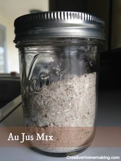 a jar filled with sand sitting on top of a counter