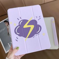 a hand holding an ipad case with a lightning on it