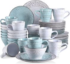 a stack of blue and white dishes sitting next to each other