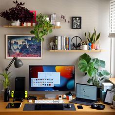 a desktop computer sitting on top of a wooden desk next to a monitor and keyboard