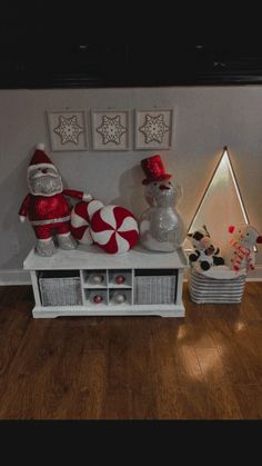 White distressed bench with white baskets. Disco Santa&frosty. Candy cane pillows, red and silver ornaments, led tree sign, and cute plushies Refurbished Bench, Cozy Room Decor, Cozy Room, The Door, Christmas Decor, Bench, Christmas Decorations, Doors, Room Decor