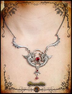 Medieval necklace siamese dragon jewelry - Handmade medieval necklace with swarovski by Dracolite on Etsy https://www.etsy.com/listing/114299390/medieval-necklace-siamese-dragon-jewelry Fantasy Metal Pendant Necklace, Medieval Style Silver Necklaces For Fantasy Events, Gothic Metal Jewelry With Dragon Design, Silver Dragon Design Jewelry For Fantasy Events, Fantasy Pendant Necklace For Fantasy Events, Fantasy Dragon Pendant Jewelry, Fantasy Dragon Design Necklace, Medieval Necklace, Medieval Dragon