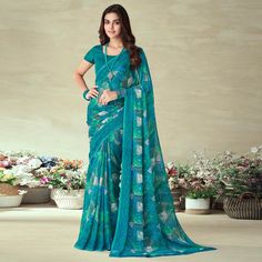 Rama Blue colored saree is made from chiffon fabric which is highlighted with beautiful printed work as shown. Comes along with unstitched chiffon blouse piece which you can customise as per your design/style. Occasion - You can wear this saree for casual and daily wear. Note:- the actual product may differ slightly in color and design from the one illustrated in the images when compared with computer or mobile screen. Measurements: Saree : Chiffon : 5.5 Mtrs Blouse : Chiffon : 0.8 Mtr Material: Chiffon Stitch Type: Unstitched Country of Origin: India Care Guide: Dry Clean Chiffon Saree, Chiffon Blouse, Blouse Piece, Chiffon Fabric, Daily Wear, Chiffon, Saree, Fashion Design, Blue