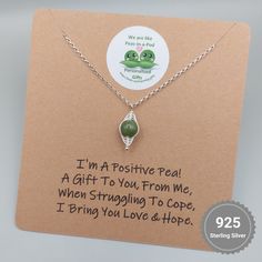 "I'm a Positive Pea, A Gift To You, From Me.  When Struggling To Cope, I Bring You Love & Hope" Express your love and affection in a unique way with this charming Positive Pea, pea pod necklace from Charming Gifts. The necklace is made from high-quality sterling silver metal, ensuring its durability and long-lasting shine. It features a beautiful round jade gemstone as the main stone, which brings good luck and positivity to the wearer. This necklace comes with a spring ring closure and a belche Spiritual Green Jewelry For Mother's Day, Inspirational Handmade Necklaces For Gifts, Spiritual Sterling Silver Necklace Ideal For Gifting, Inspirational Handmade Necklace For Gift, Inspirational Handmade Necklace Gift, Spiritual Sterling Silver Necklace Gift, Meaningful Handmade Necklace For Gift, Spiritual Sterling Silver Necklace, Meaningful Handmade Jewelry For Birthday Gift