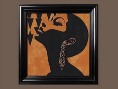 an african woman's profile is framed in a black frame with orange and brown background