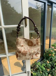 Features: Item: Elegant Retro Jacquard Shoulder Bags Handbags Material: Cotton & Linen Opening Method: Magnetic Buckle Inner Structure: Zipper Hidden Pocket Hardness: Soft Style: Daily Size: Medium（Height 21.5cm, Bottom Width 22.5cm, Handle Length 17cm） Beige Pouch Shoulder Bag With Handles, Beige Pouch Bag With Handles, Brown Handheld Canvas Bag, Handheld Brown Canvas Travel Bag, Brown Fabric Shoulder Bag With Large Capacity, Beige Canvas Bag With Handle Drop For Daily Use, Brown Large Capacity Fabric Shoulder Bag, Brown Leather Handheld Hobo Bag, Large Capacity Brown Fabric Shoulder Bag