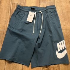 The Nike Sportswear Shorts Feature Unfinished Hems And A Ribbed Waist With Drawcord For A Vintage Vibe. French Terry Cotton Delivers A Soft Touch And Everyday Durability. Shown: Midnight Navy/White Style: At5267-410 Nike Cotton Pants With Moisture-wicking, Blue Sporty Sweatpants With Drawstring, Sporty Blue Joggers With Drawstring, Sporty Blue Sweatpants With Drawstring, Nike Cotton Gym Pants, Summer Sports Sweatpants With Drawstring, Casual Short Leg Pants For Gym, Nike Cotton Sweatpants For Gym, Nike Short Bottoms For Sports