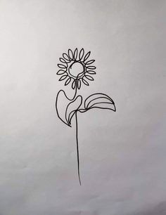 a drawing of a sunflower on white paper