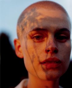 an image of a man with his face painted white