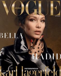 a magazine cover with a woman wearing a black jacket and polka dots on her arm