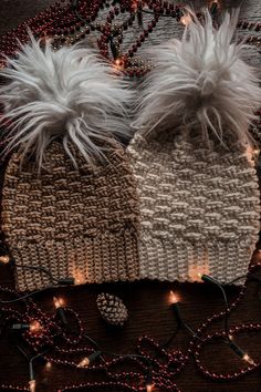 two knitted hats with white fur pom - poms on them and the words free crochet pattern