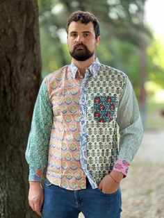 This funky patchwork 100% cotton shirt is handmade and block printed. It features long sleeves and a pocket in an upper left side. It closes by buttons. This shirt is free from the dictates of mass production being handmade by skilled woodblock artisans using exclusively local high quality cotton. It is somehow exotic, funky and fun but at the same time stylish in an own particular way. SIZE Shoulders 50 cm Chest 116 cm Sleeve 61 cm Length 75 cm This item is handmade so it may present minor irre Cotton Long Sleeve Tops With Unique Print, Casual Long Sleeve Shirt For Festival, Multicolor Long Sleeve Shirt For Festivals, Cotton Tops With Mixed Print, Multicolor Bohemian Cotton Shirt, Multicolor Cotton Shirt With Unique Print, Bohemian Multicolor Shirt For Festivals, Multicolor Bohemian Shirt For Festivals, Bohemian Multicolor Cotton Shirt