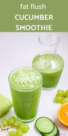 cucumber smoothie in two glasses with orange slices and grapes on the side