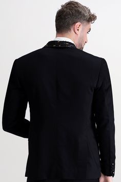 Exude sophistication and mystery with our Jade Black Wool Rich Tuxedo Designer Blazer adorned with exquisite Aari work on the lapel and a single-button fastening. This majestic ensemble seamlessly blends tradition with modernity, adding a touch of regal charm to your look. The aari work and single-button fastening add an elegant touch, elevating your style to red-carpet elegance. Whether it's a gala, wedding, or a night to remember, this sleek ensemble guarantees a sharp and suave look that's un Brown Suede Chelsea Boots, Designer Suit, Tuxedo Blazer, Suede Chelsea Boots, A Night To Remember, Blazer Designs, Tuxedo Suit, Long Blazer, Aari Work