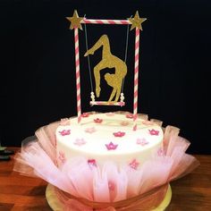 a cake decorated with pink and gold decorations