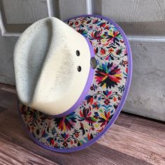 This beautiful Mexican Sombrero has would be perfect to add that special touch to any outfit. MADE IN MEXICO By: Mexican Artisans For: Women Size: Medium 23' Color: off-white | multi Details: Material: palm straw Fabric canvas design Bottom brown suede Inner elastic band Contact us for more details PLEASE READ BEFORE PURCHASE: The picture is an ACCURATE REPRESENTATION.Colors in the pictures may vary a little by effects of light. Each product is handmade from Mexico causing differentiation and mi Multicolor Toquilla Straw Fedora Hat, Multicolor Toquilla Straw Fedora, Multicolor Fedora Hat In Toquilla Straw, White Toquilla Straw Panama Hat For Festivals, Wide Brim Straw Hat For Cinco De Mayo Festival, Wide Brim Beach Hat For Cinco De Mayo, Multicolor Wide Brim Panama Hat In Toquilla Straw, Wide Brim Hats For Beach And Cinco De Mayo, White Bohemian Woven Hat