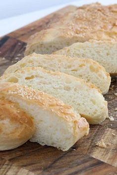 sliced bread sitting on top of a wooden cutting board