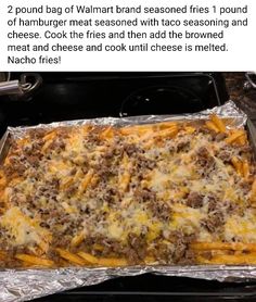 an image of a casserole dish with meat and cheese in it on tin foil