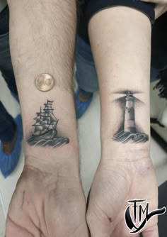 two people with matching tattoos on their arms holding each other's hands, one has a lighthouse and the other has a ship