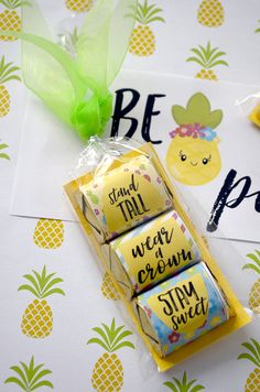 some candy wrapped in plastic and sitting on top of a wrapper with pineapples