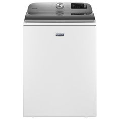 a white washer sitting on top of a dryer