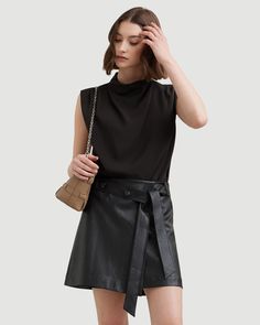 A mini skirt with a subtle edge in a soft vegan leather adds effortless polish to any wardrobe. Pair with everything from a black blouse in warmer weather to a chunky knit for a cozy look. See below for our general Size Guide and available measurements Self made of 100% polyurethane, lining made of 100% polyester Machine wash cold and lay flat to dry Sleek Fall Mini Skirt For Workwear, Chic Fall Mini Skirt For Office, Chic Relaxed Mini Skirt For Workwear, Versatile Black Skirt For Fall, Chic Mini Skirt For Workwear In Winter, Chic Relaxed Mini Skirt For Fall, Chic Winter Mini Skirt For Workwear, Modern Mini Skirt For Fall Night Out, Chic Fall Mini Skirt For Work