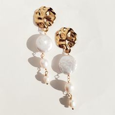 Beautiful and Unique Baroque Pearl Drop Earrings are perfect for an elegant look, they are made of Baroque Pearls and set on 18k gold plated stainless steel studs. I'm obsessed with this statement design. They are perfect for a bridal/wedding/special occasion. Light-weight DesignSold in pairDETAILSWater Resistant- skin-friendlyLength 3 inch Chic Tarnish-resistant Wedding Jewelry, Glamorous Gold Plated Earrings For Weddings, Glamorous Gold Plated Wedding Earrings, Glamorous Metal Pearl Earrings For Gift, White Metal Earrings, Tarnish Resistant, White Metal Earrings Tarnish Resistant, Chic Tarnish Resistant Wedding Jewelry, Chic Metal Jewelry For Wedding, Chic Wedding Jewelry In Metal