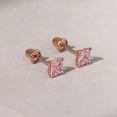 SKU : DJBSQ4010 This 14K Yellow Gold Pink Cubic Zirconia Basket Set Solitaire Cartilage Stud Earrings is a meticulously crafted and beautiful earring. Specifications Metal color: 14K Yellow Gold Dimensions: Available in 4 mm, and 5 mm Stone Shape: Princess Stone Color: Pink Material: Solid 14K Gold Our stones are the highest quality diamond simulants that are polished, finely cut, loupe clean, and have an exactly similar appearance and as beautiful as to naturally occurring diamonds. All cubic zirconia stone weights are approximate and listed as diamond equivalent weight in carats. All jewelry is new and inspected for quality assurance. Ships from the United States to ensure quality, reliability, and punctuality. Cartilage Stud Earrings, Cartilage Earrings Stud, Cartilage Stud, Solitaire Setting, Basket Set, Diamond Simulant, Hypoallergenic Earrings, Pink Princess, Quality Diamonds