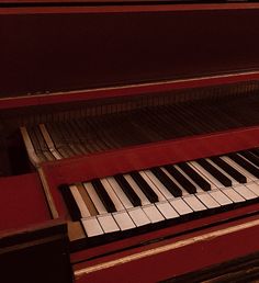 a red piano with white and black keys