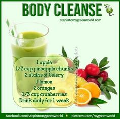 a green smoothie with oranges and cranberries in it