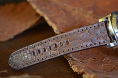 RECOMMENDATION FOR STRAP LENGTH : WRIST SIZE 15-17 CM - 115/75 MM STRAP LENGTH WRIST SIZE 17,5-19 CM - 130/80 MM STRAP LENGTH Caracteristics: Model : PYTHON - VINTAGE BROWN MATTE I Genuine PYTHON SNAKE BELLY LEATHER Color : BROWN Matte Handmade Spain ONLY VALID FOR TANG BUCKLE (PHOTOS) Width : 26/24/22 mm (at the watch) - 26/24/22 mm (at the buckle) Length : 130 / 80 mm - 115 / 75 mm Thickness : aprox. 3,5 mm Edges : PAINTED Keeper : 1 fix + 1 floating Inox. tubes included (Width 26 + 24 mm) Wat Luxury Handmade Brown Watch Bands, Classic Handmade Brown Watch Accessories, Luxury Handmade Brown Watch Accessories, Custom Handmade Brown Watch Bands, Brown I, Matte Skin, Python Snake, Vintage Band, Leather Pouch