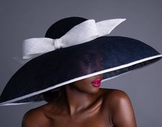 "This stunningly gorgeous extra large navy & white Audrey Hepburn style dome hat is made from sinamay with navy polkadot chiffon layer on top.  It is adorned with large white sinamay bow.  The edging of the hat is trimmed with white petersham ribbon. It is ideal for Royal Ascot,  Ladies Day, Weddings,  Wedding Guest, Mother of the bride or groom and Church. This is an absolute showstopper.  Measurements as follows: The head size = 22.5 inches.  Diameter = 22 inches  Circumference = 69.5\" I can Elegant Navy Wide Brim Hat, Elegant Navy Hat With Curved Brim, Elegant Navy Hats With Curved Brim, Royal Ascot Ladies Day, Ascot Ladies Day, Black Floppy Hat, Classy Hats, Audrey Hepburn Style, Ascot Hats