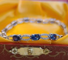 This is a simple diamonds and sapphires bracelet. 14 pieces of sapphires size 6×4 mm, total weight 7.70 carats. 141 pieces of diamonds total weight 0.70 carats. 18k white gold bracelet setting weight 8.50 grams. White Gold Sapphire, Simple Diamonds, White Gold Bracelet, Contemporary Ring, Sapphire Bracelet, Sapphire Gemstone, Rose Gold Diamonds, Chain Link Bracelet, Link Bracelets