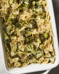 a casserole dish filled with pasta and broccoli