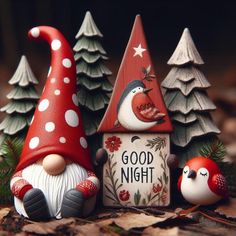 three gnome figurines sitting next to each other in front of some christmas trees