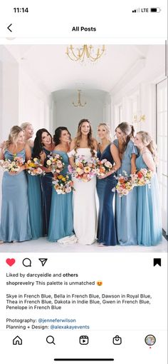 a group of women standing next to each other in front of a chandelier